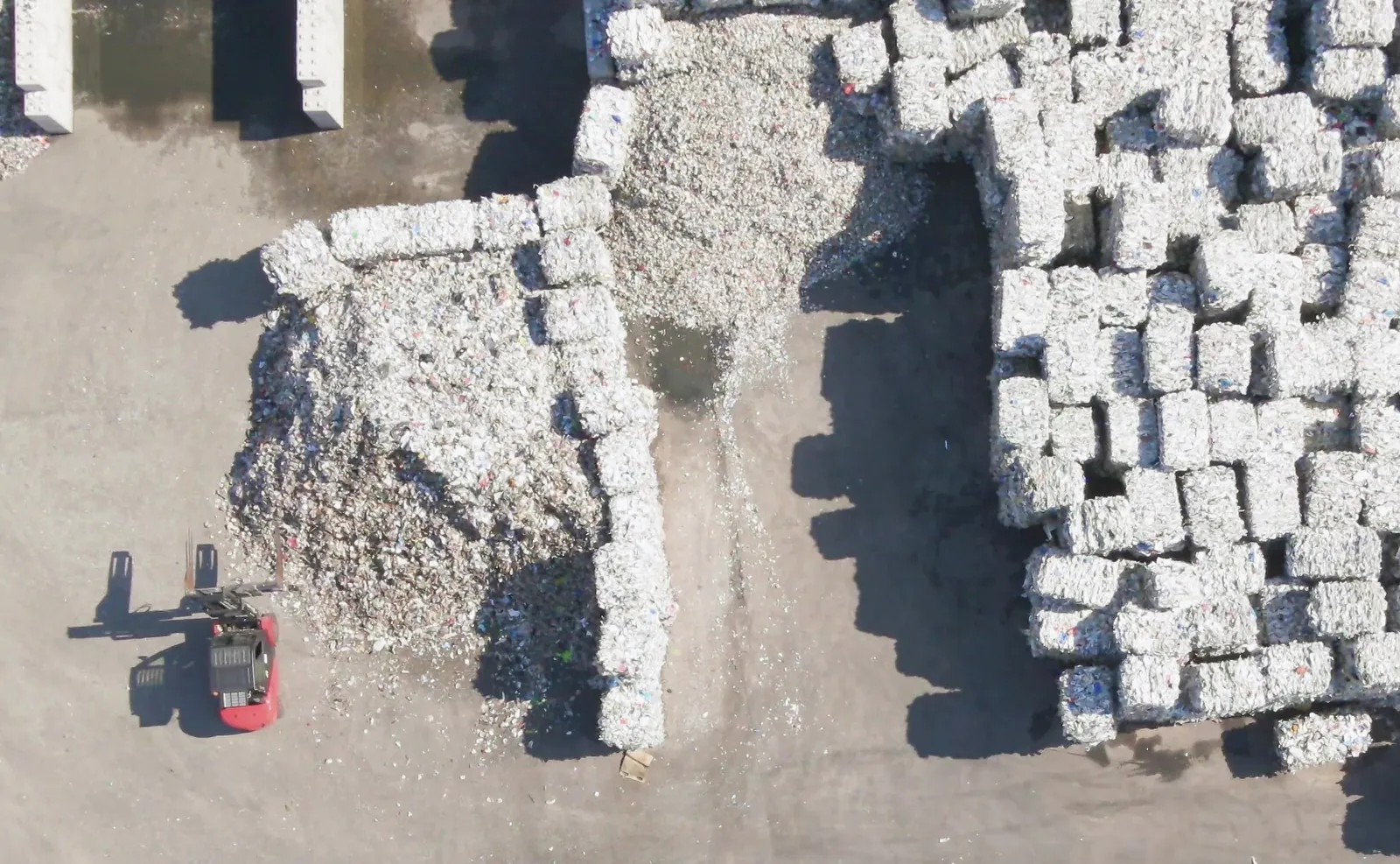 Aerial view of baled recyclable waste at a recycling facility